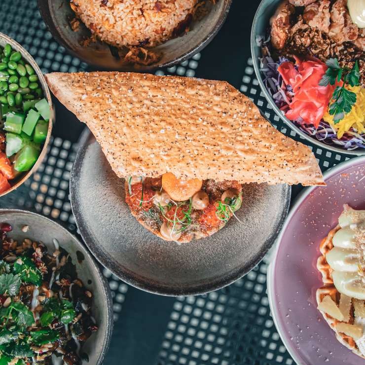 Overhead photo of a banquet of appetising dishes