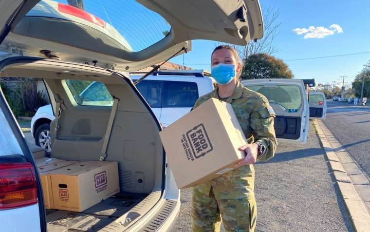 Member of ADF assisting with FoodBank deliveries during COVID-19.