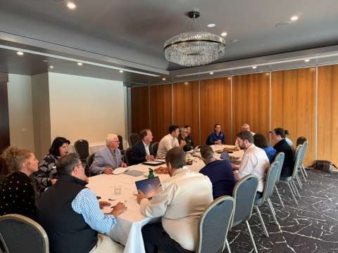 An engagement group sitting around a large table